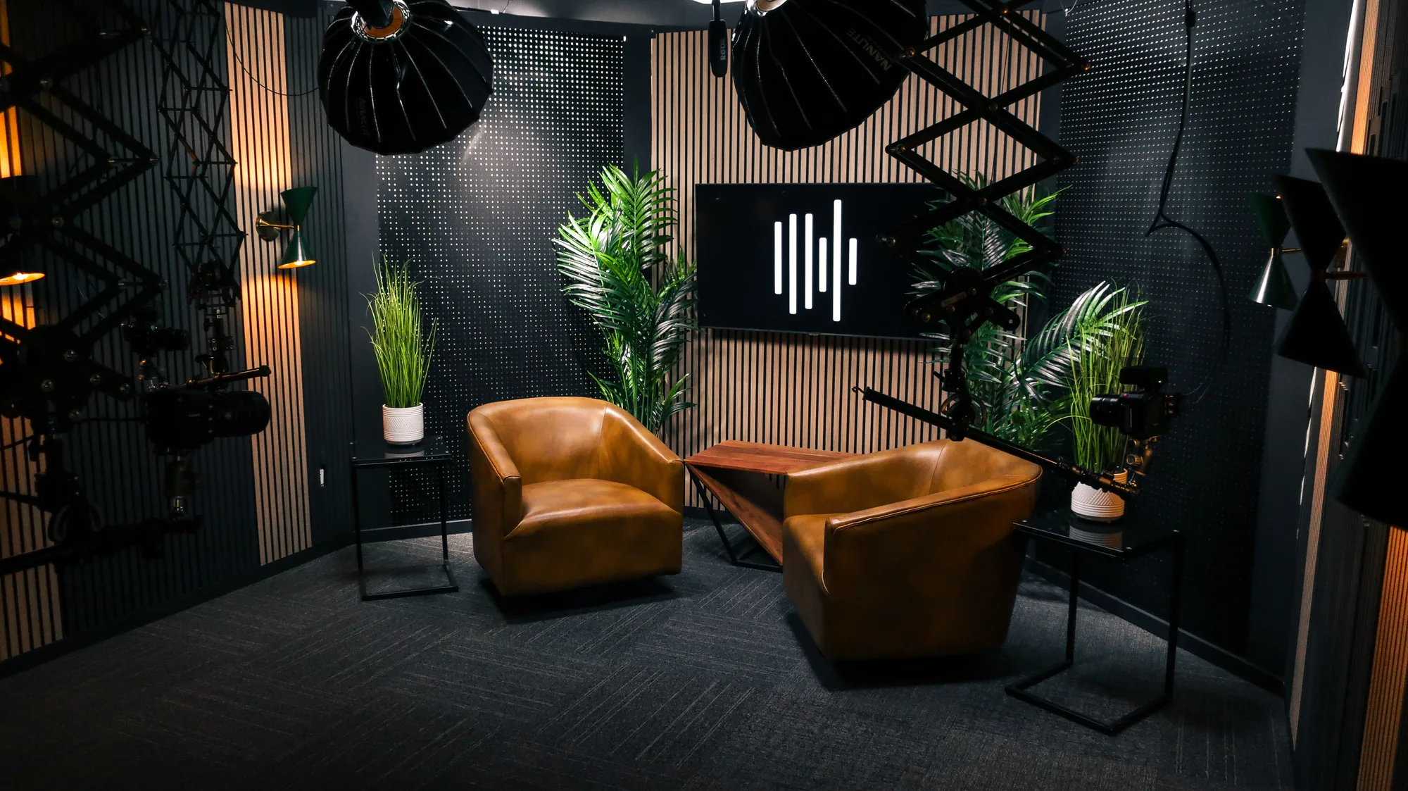 Studio A — two leather chairs with SoundShed logo lit